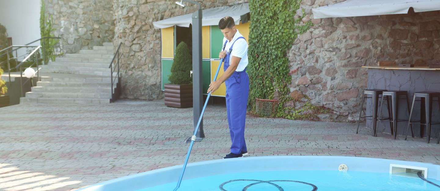 Employee from one of the swimming pool cleaning companies in RAK at work