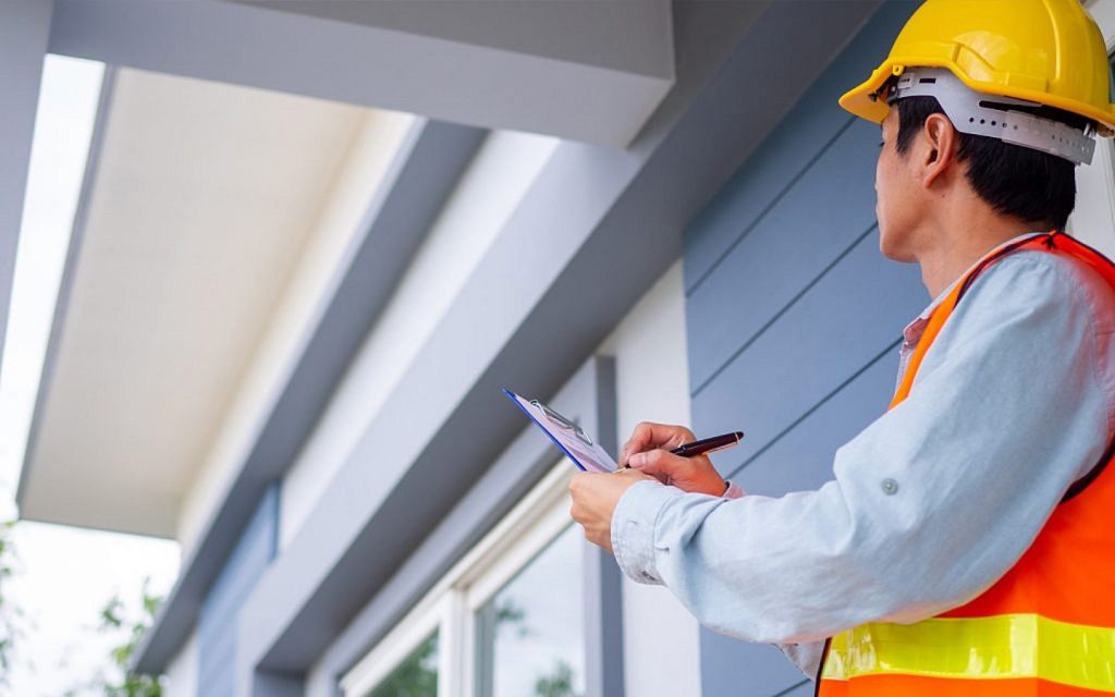 A professional inspecting a real estate unit
