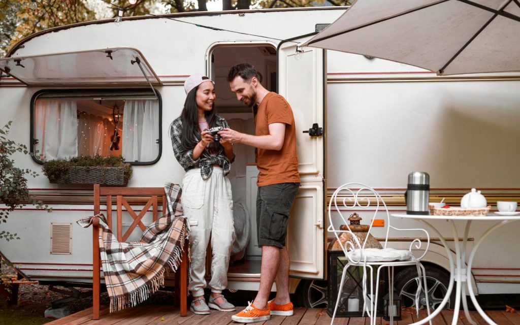 Couple standing outside RV home