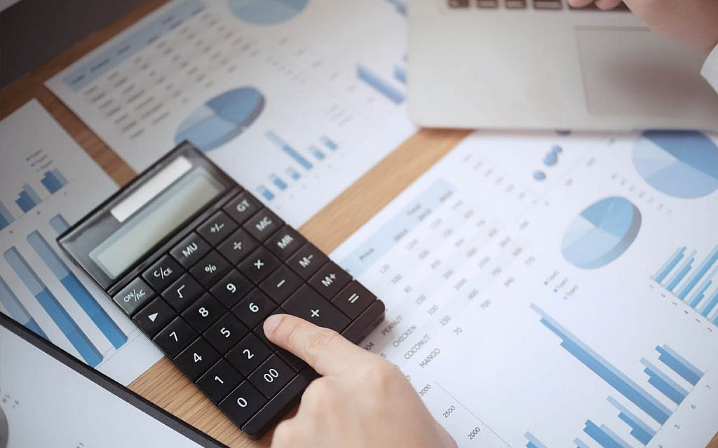 person calculating Property booking amount in Dubai